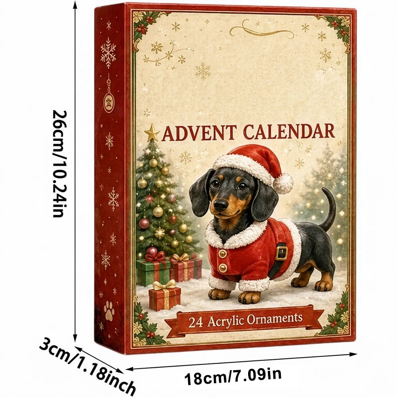 A Christmas advent calendar box shown with printed dimensions around it. The front features a dachshund wearing a Santa hat and red coat beside a decorated Christmas tree and gifts, with the text 'ADVENT CALENDAR' and '24 Acrylic Ornaments.