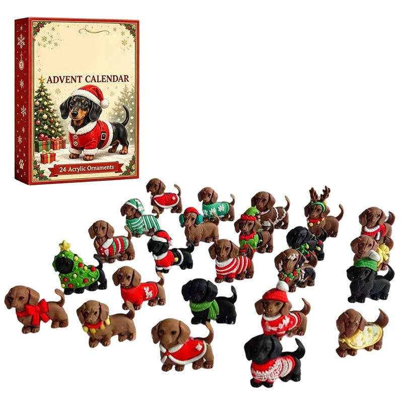 A Christmas advent calendar set featuring a decorative box labeled 'ADVENT CALENDAR' with an illustration of a dachshund in a Santa hat, alongside multiple small dachshund ornaments dressed in various holiday sweaters and outfits, arranged on a plain white background.