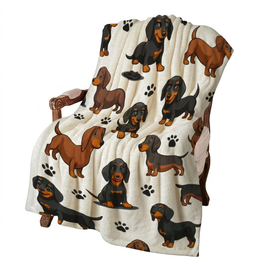 A cream-colored throw blanket featuring a cartoon dachshund pattern, draped over a wooden chair in a decorated room with red roses and gift boxes.