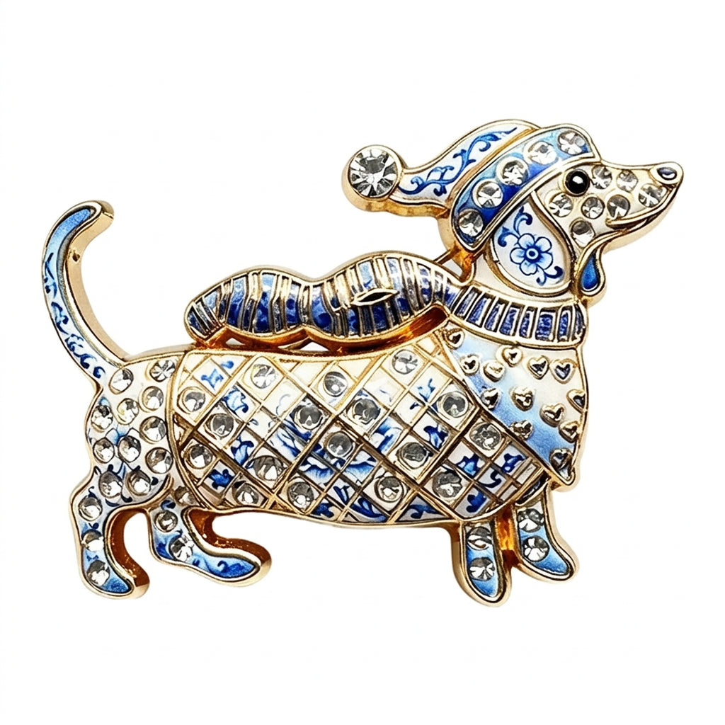 A gold-tone dachshund-shaped brooch embellished with blue enamel, floral patterns, and clear rhinestones, shown on a plain white background with the Wuli & baby brand logo in the top left corner.
